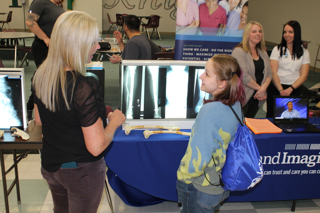 Student and vendor looking at xrays