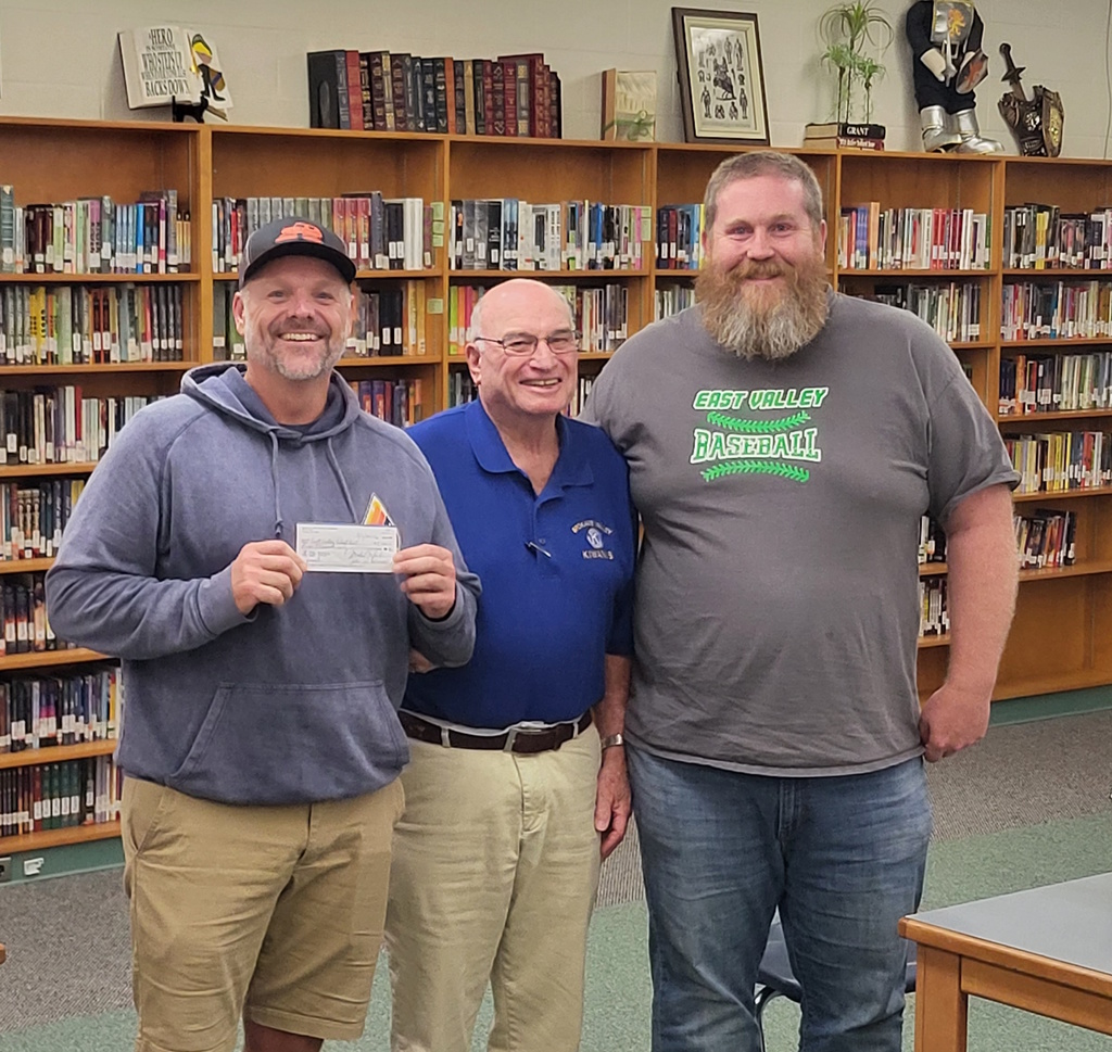 Jon Larson, Mike Jackson, and Mat Orndorff posing for a picture with a grant award
